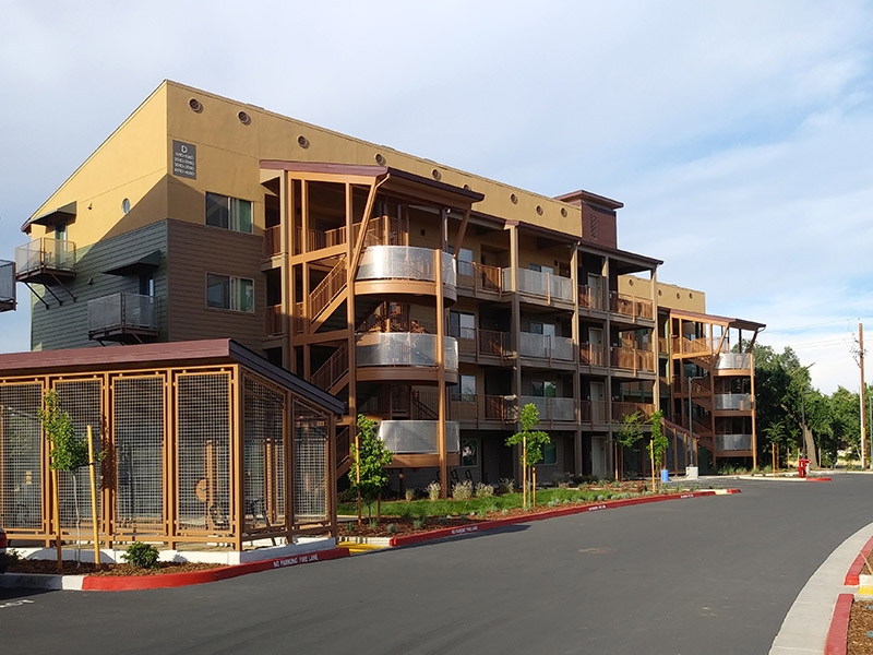 exterior image of creekside apartments showing a multi story building with balconies